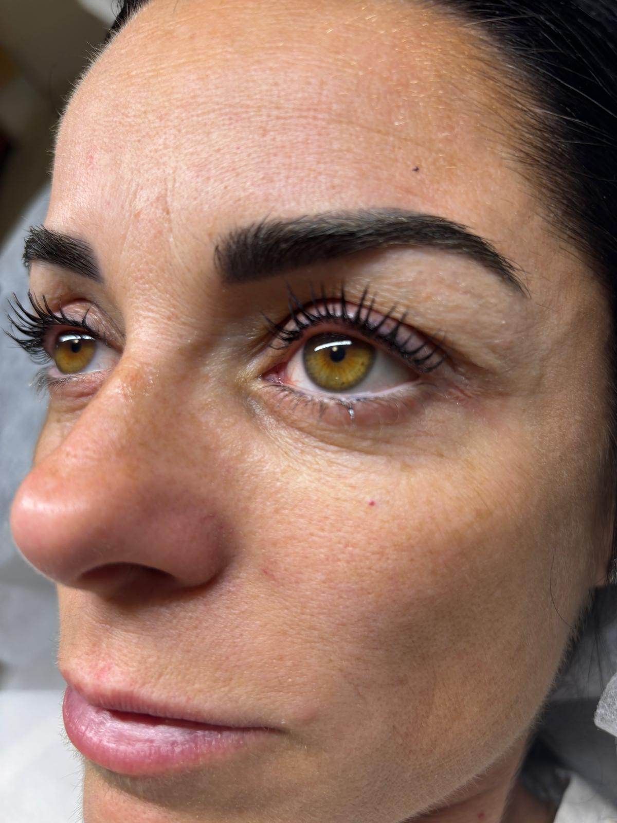 Lifted lashes and shaped brows on a WICC Beauty client